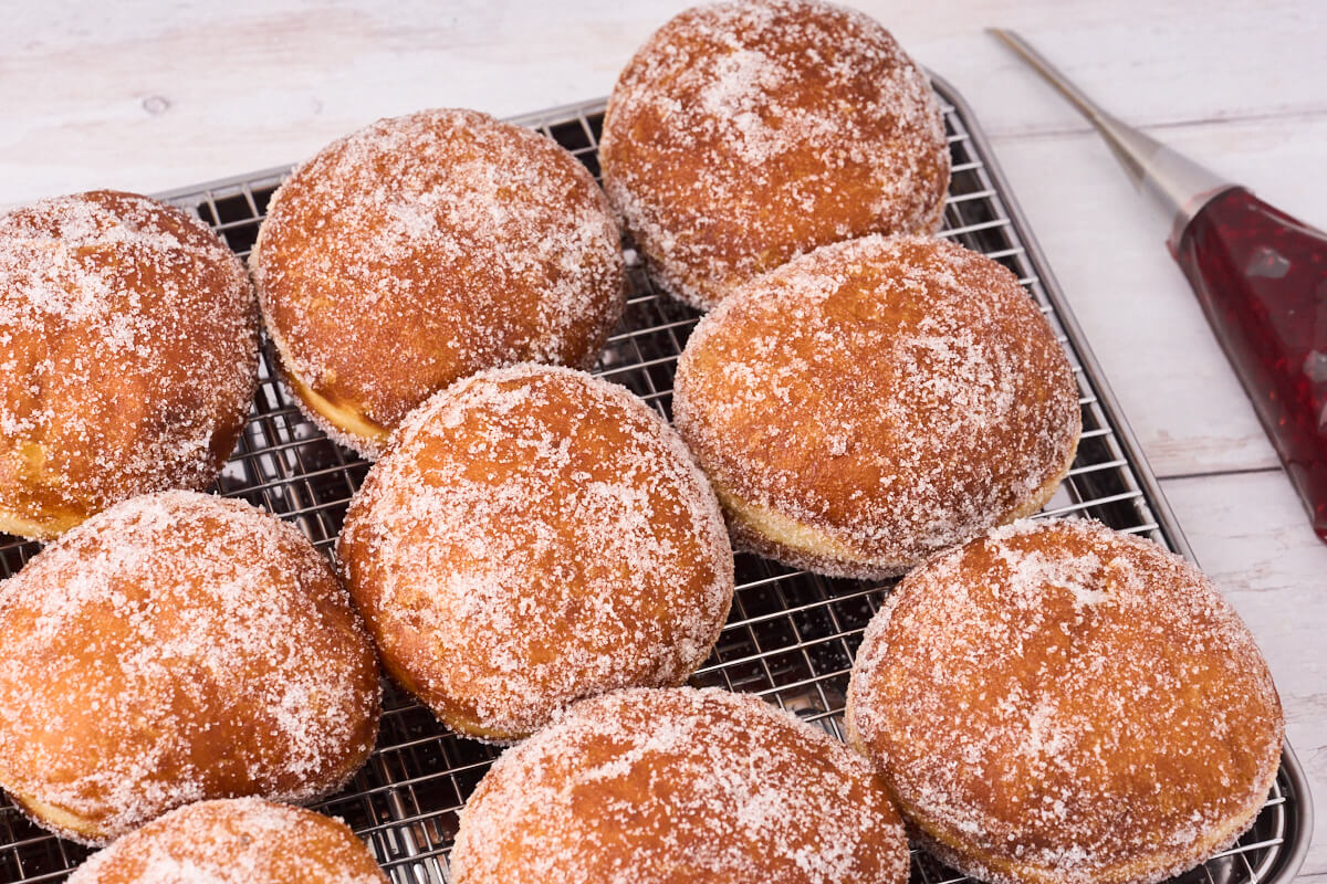 berliner pfannkuchen ready to be filled with raspberry jam.