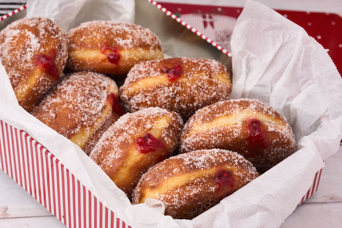 Berliner Pfannkuchen with raspberry jam in a christmas box.