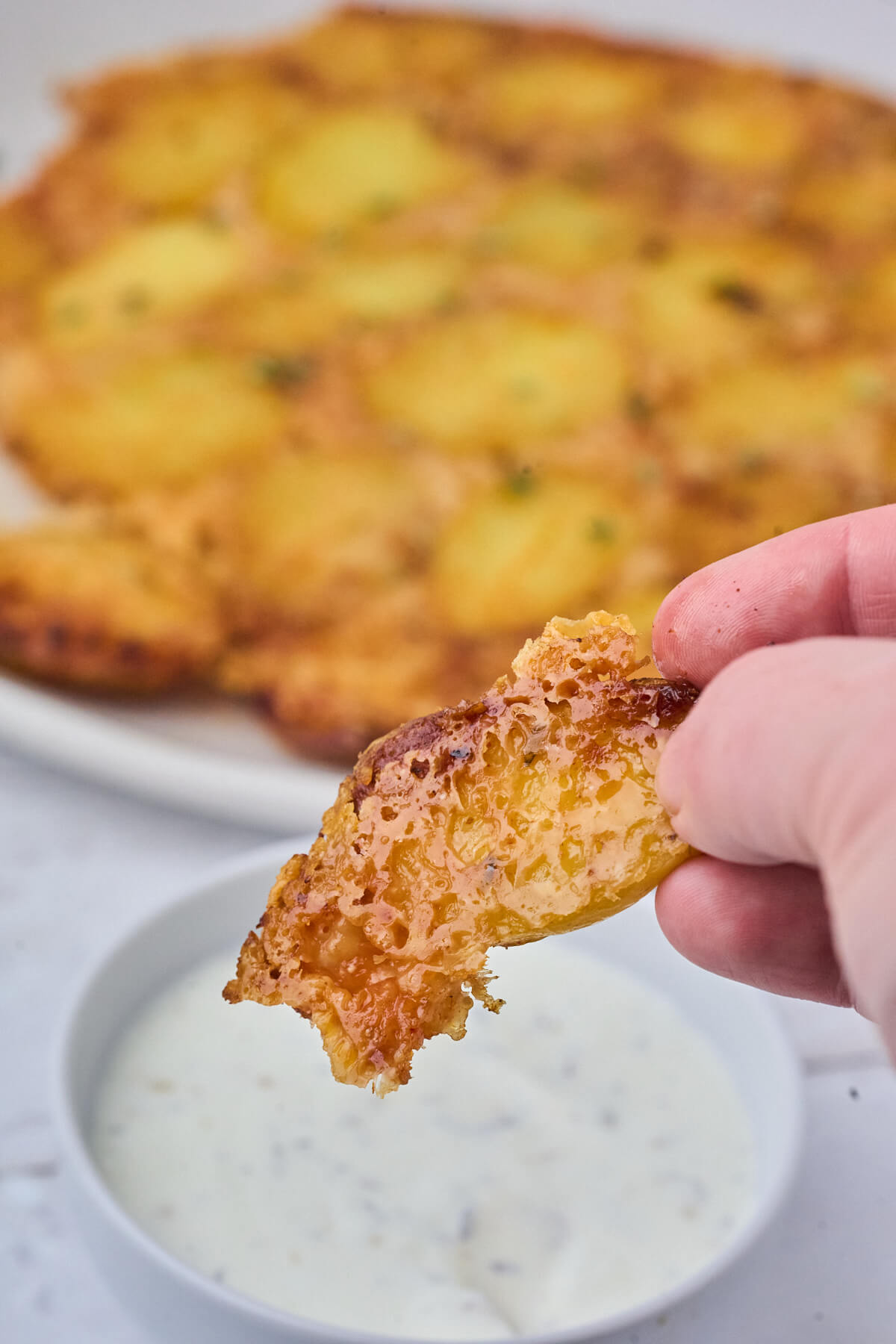 crispy potato with parmesan dipped in dipping sauce.